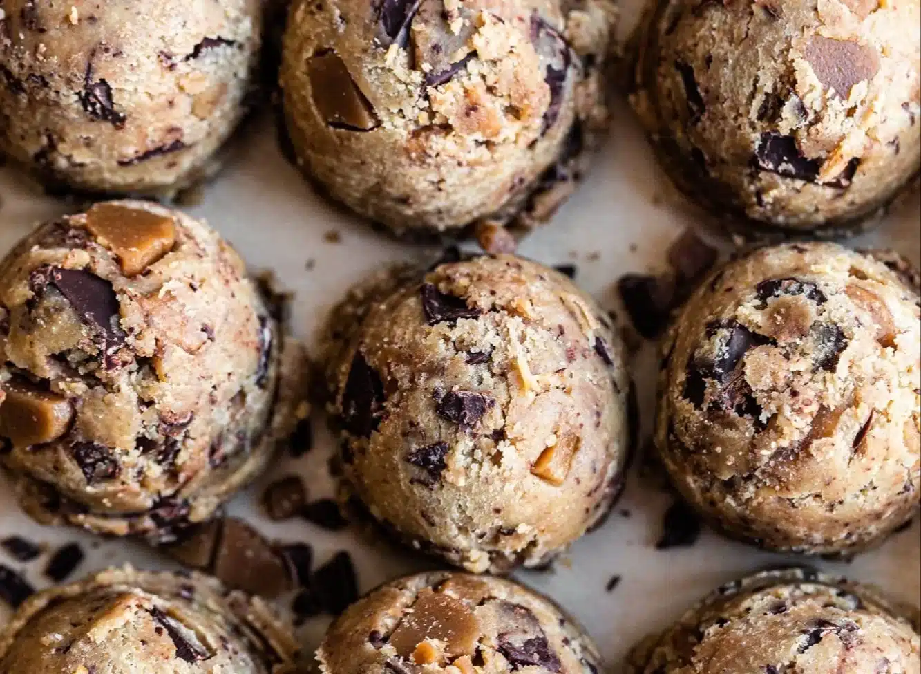 Browned butter toffee chocolate chip cookies on a festive plate.