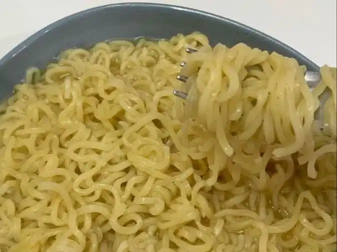 Delicious noodles served with soda and dessert in a cozy food therapy setting